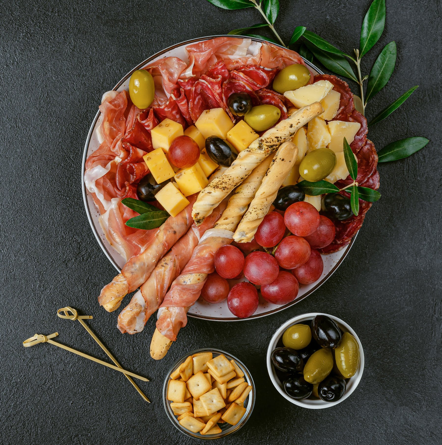 Appetizer set platter on dark background. directly above, copy space.